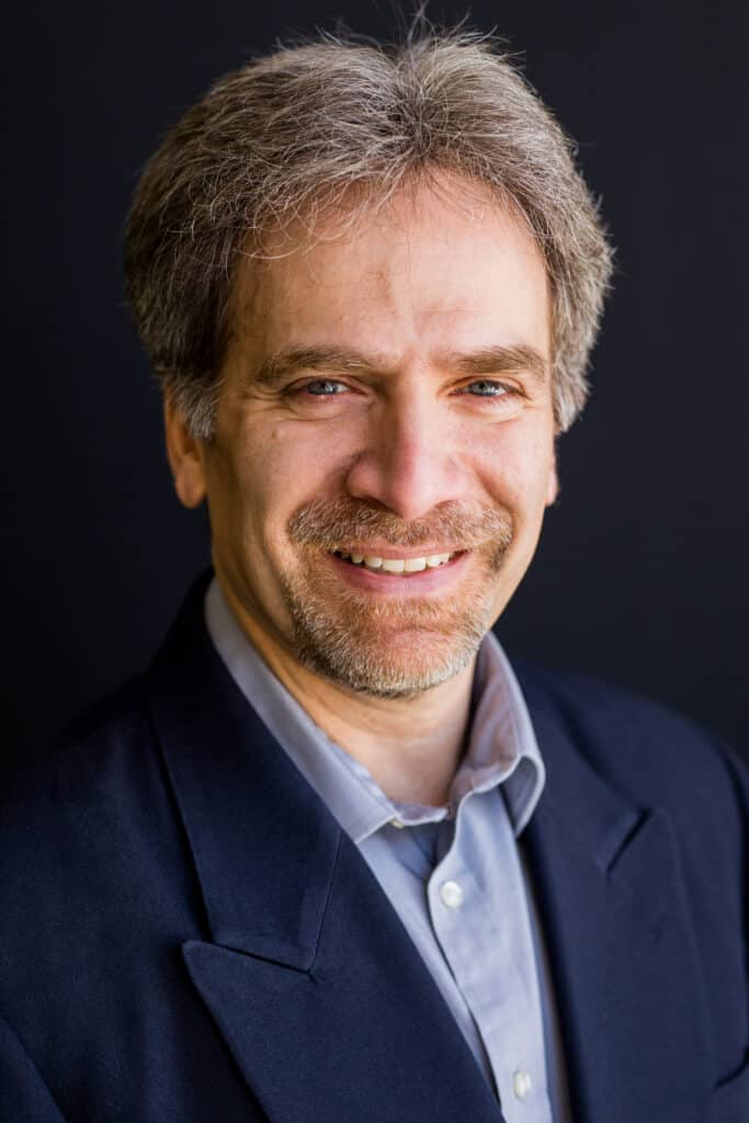 a headshot of Sam Fiorani, Vice President of Global Vehicle Forecasting for AutoForecast Solutions