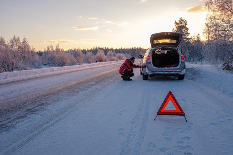 broken on a snowy winter road P94P7KH