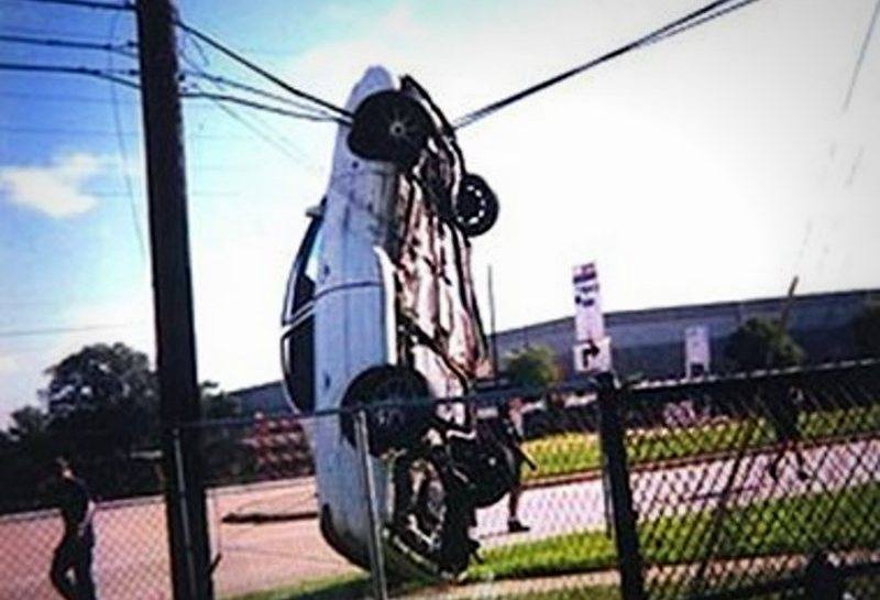 Car hanging from power line