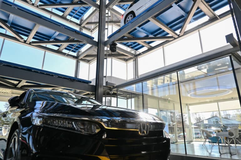 A car sits inside a Carvana vending machine ready for its buyer.