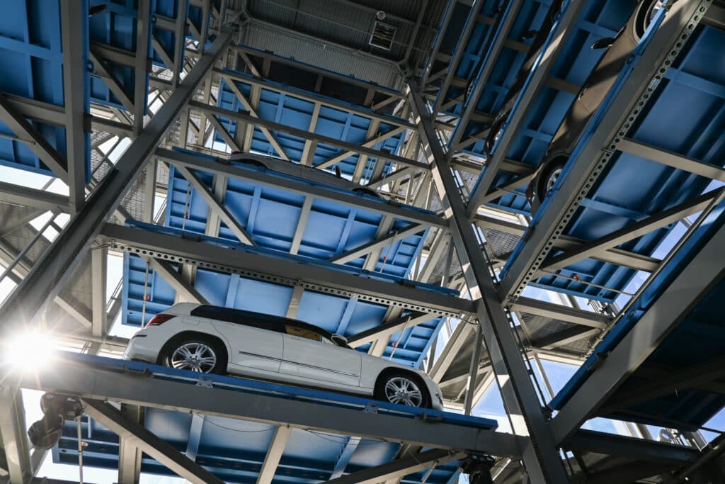 Vehicles inside a Carvana vending machine tower, as seen from the inside.