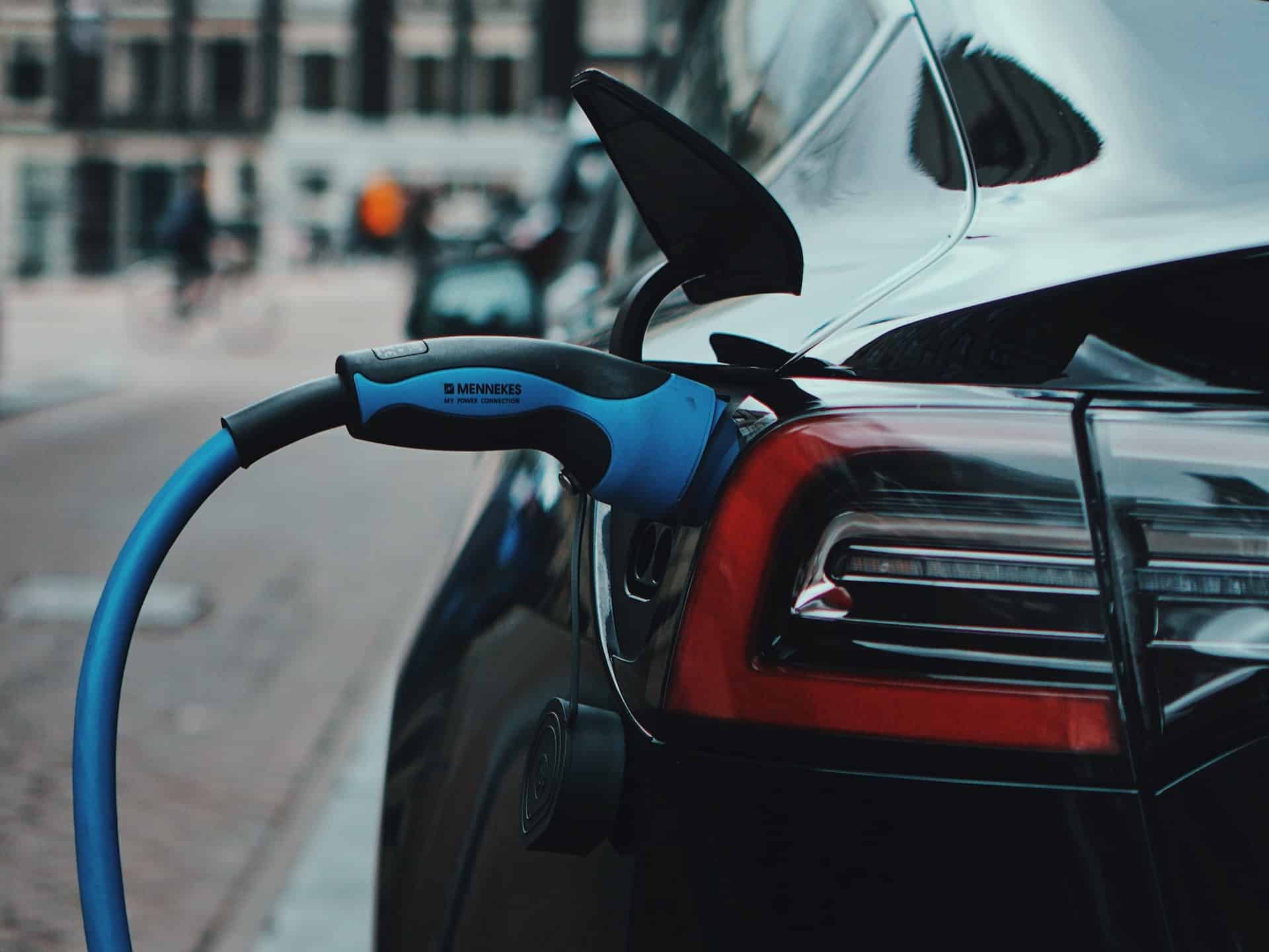 an electrtic vehicle charging at an ev charging station